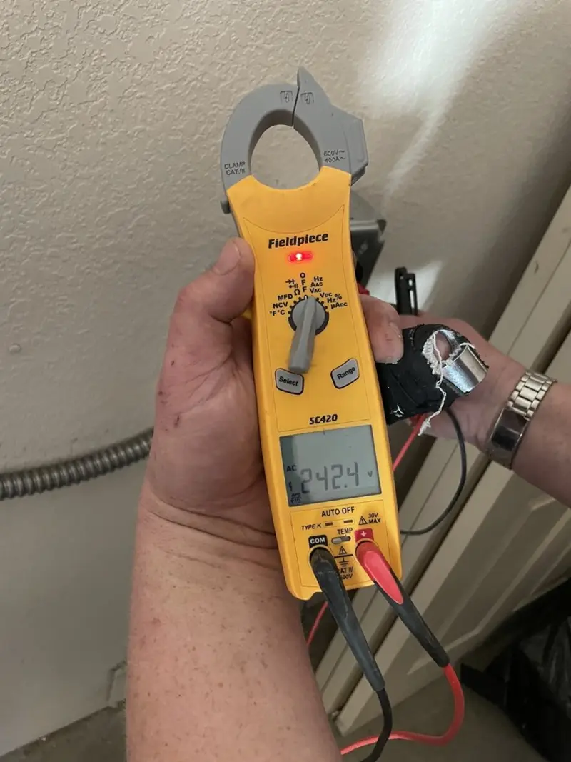 Voltage testing with clamp meter during Generator Installation in Pembroke Pines